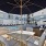 shaded lounge chairs next to outdoor swimming pool